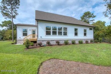 Welcome to this beautifully appointed 4-bedroom, 3-bath home on Carolina National Golf Club in North Carolina - for sale on GolfHomes.com, golf home, golf lot