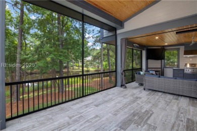 Enjoying views across a lake toward Moss Creek South's 8th Hole on Moss Creek Golf Club in South Carolina - for sale on GolfHomes.com, golf home, golf lot