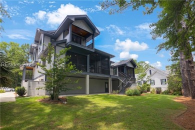 Enjoying views across a lake toward Moss Creek South's 8th Hole on Moss Creek Golf Club in South Carolina - for sale on GolfHomes.com, golf home, golf lot