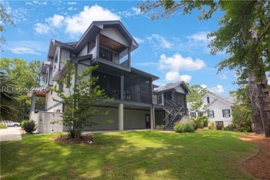 Enjoying views across a lake toward Moss Creek South's 8th Hole on Moss Creek Golf Club in South Carolina - for sale on GolfHomes.com, golf home, golf lot