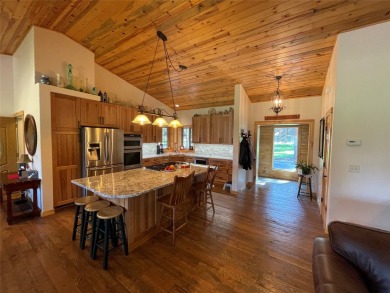 Beautiful open concept single level custom home overlooking the on Double Arrow Lodge in Montana - for sale on GolfHomes.com, golf home, golf lot