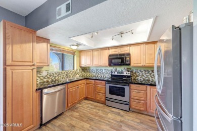 Beautifully maintained 4-bed, 3-bath tri-level townhome in gated on Dobson Ranch Municipal Golf Course in Arizona - for sale on GolfHomes.com, golf home, golf lot