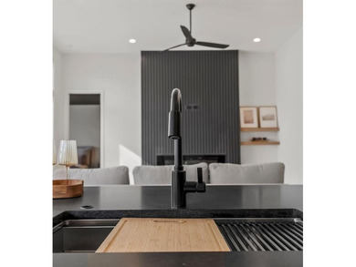 This new reverse 1.5-story Somerset plan by Elevate Design + on Heritage Park Golf Course in Kansas - for sale on GolfHomes.com, golf home, golf lot