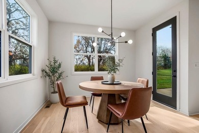 This new reverse 1.5-story Somerset plan by Elevate Design + on Heritage Park Golf Course in Kansas - for sale on GolfHomes.com, golf home, golf lot