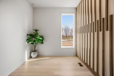 This new reverse 1.5-story Somerset plan by Elevate Design + on Heritage Park Golf Course in Kansas - for sale on GolfHomes.com, golf home, golf lot