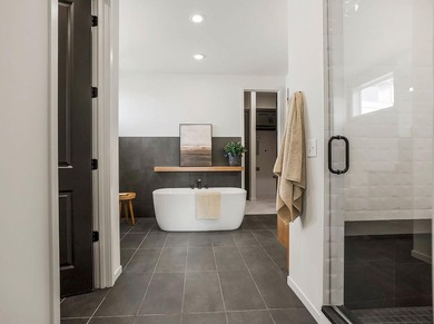 This new reverse 1.5-story Somerset plan by Elevate Design + on Heritage Park Golf Course in Kansas - for sale on GolfHomes.com, golf home, golf lot