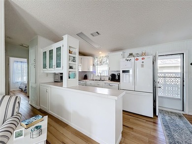 Turnkey Coastal Canal-View Home with Golf Cart in Lily Lake Golf on Lily Lake Golf and RV Resort in Florida - for sale on GolfHomes.com, golf home, golf lot