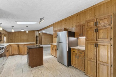 Welcome to this beautifully updated 4-bedroom, 2-bath ranch home on Indian River Golf Club in Michigan - for sale on GolfHomes.com, golf home, golf lot