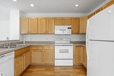 Enjoy the ease of main-floor living in this beautifully on Crown Golf Course in Michigan - for sale on GolfHomes.com, golf home, golf lot