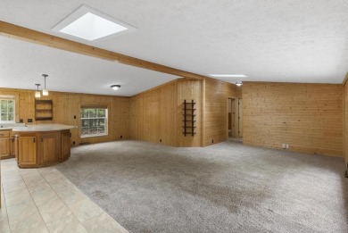 Welcome to this beautifully updated 4-bedroom, 2-bath ranch home on Indian River Golf Club in Michigan - for sale on GolfHomes.com, golf home, golf lot