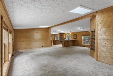 Welcome to this beautifully updated 4-bedroom, 2-bath ranch home on Indian River Golf Club in Michigan - for sale on GolfHomes.com, golf home, golf lot