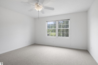Enjoy the ease of main-floor living in this beautifully on Crown Golf Course in Michigan - for sale on GolfHomes.com, golf home, golf lot