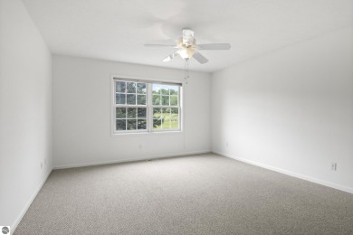 Enjoy the ease of main-floor living in this beautifully on Crown Golf Course in Michigan - for sale on GolfHomes.com, golf home, golf lot