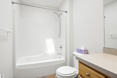 Enjoy the ease of main-floor living in this beautifully on Crown Golf Course in Michigan - for sale on GolfHomes.com, golf home, golf lot