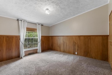 Welcome to this beautifully updated 4-bedroom, 2-bath ranch home on Indian River Golf Club in Michigan - for sale on GolfHomes.com, golf home, golf lot