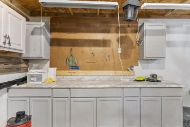 Welcome to this beautifully updated 4-bedroom, 2-bath ranch home on Indian River Golf Club in Michigan - for sale on GolfHomes.com, golf home, golf lot
