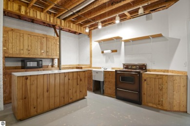 Enjoy the ease of main-floor living in this beautifully on Crown Golf Course in Michigan - for sale on GolfHomes.com, golf home, golf lot