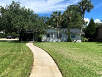 Check out this Country Club home that sits on a half acre lot on Gainesville Golf and Country Club in Florida - for sale on GolfHomes.com, golf home, golf lot