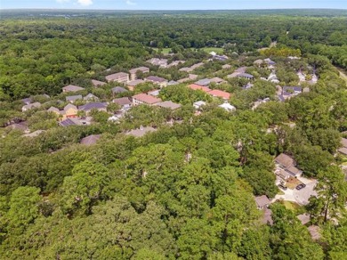 This lovely home is located in a cul-de-sac in charming Camden on Haile Plantation Golf and Country Club in Florida - for sale on GolfHomes.com, golf home, golf lot