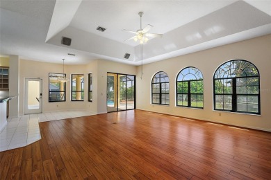 WECOME HOME!  The scenic views of this executive pool home will on Harbor Hills Country Club in Florida - for sale on GolfHomes.com, golf home, golf lot