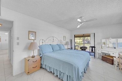 This second-floor unit in Hidden Woods of Deer Creek is a prime on Deer Creek Golf Club in Florida - for sale on GolfHomes.com, golf home, golf lot