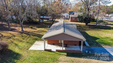 Step inside this charming 1960 brick ranch home located in on Cherryville Golf and  Country Club in North Carolina - for sale on GolfHomes.com, golf home, golf lot