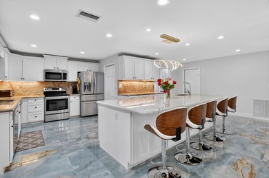 Totally renovated and a delight to see.  Picture perfect and on Boca Greens Country Club in Florida - for sale on GolfHomes.com, golf home, golf lot