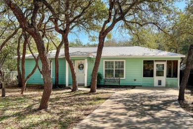 Nestled beneath large shade oak trees, this fully furnished on Rockport Country Club in Texas - for sale on GolfHomes.com, golf home, golf lot