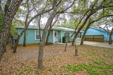 Nestled beneath large shade oak trees, this fully furnished on Rockport Country Club in Texas - for sale on GolfHomes.com, golf home, golf lot