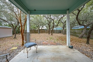 Nestled beneath large shade oak trees, this fully furnished on Rockport Country Club in Texas - for sale on GolfHomes.com, golf home, golf lot