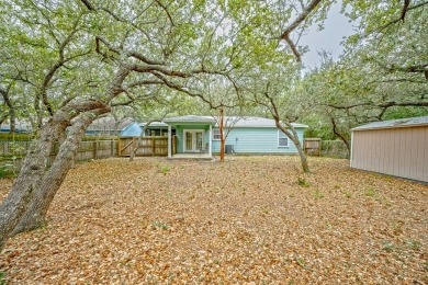 Nestled beneath large shade oak trees, this fully furnished on Rockport Country Club in Texas - for sale on GolfHomes.com, golf home, golf lot