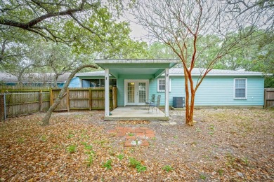 Nestled beneath large shade oak trees, this fully furnished on Rockport Country Club in Texas - for sale on GolfHomes.com, golf home, golf lot