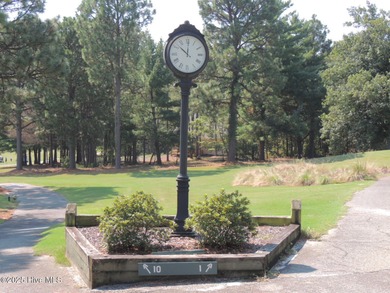 Discover the perfect blend of comfort, lifestyle, and location on Seven Lakes Country Club in North Carolina - for sale on GolfHomes.com, golf home, golf lot