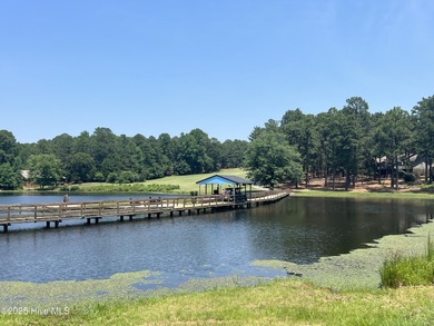 Discover the perfect blend of comfort, lifestyle, and location on Seven Lakes Country Club in North Carolina - for sale on GolfHomes.com, golf home, golf lot