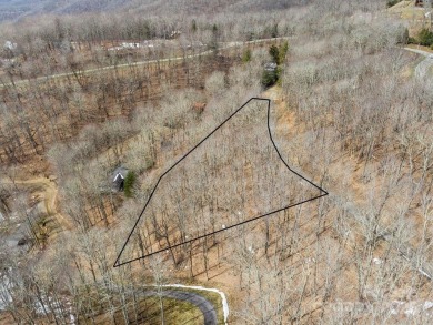 Nestled in woods of the Blue Ridge Mountains, behind protected on Wolf Laurel Country Club in North Carolina - for sale on GolfHomes.com, golf home, golf lot