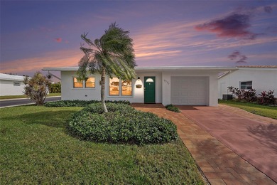 Welcome to this beautifully updated 2-bedroom, 2-bath home on Mainlands Golf Club in Florida - for sale on GolfHomes.com, golf home, golf lot