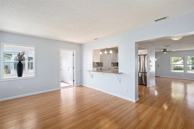 Welcome to this beautifully updated 2-bedroom, 2-bath home on Mainlands Golf Club in Florida - for sale on GolfHomes.com, golf home, golf lot