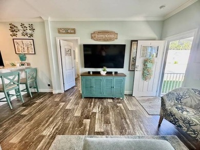 Welcome home to this impeccable 2-bedroom 2-bath sanctuary on Cypresswood Golf and Country Club in Florida - for sale on GolfHomes.com, golf home, golf lot