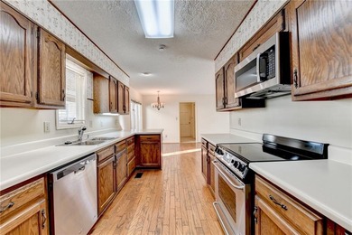 Nestled along the 5th fairway, this beautifully positioned home on Country Club of Roswell in Georgia - for sale on GolfHomes.com, golf home, golf lot