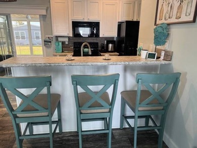 Welcome home to this impeccable 2-bedroom 2-bath sanctuary on Cypresswood Golf and Country Club in Florida - for sale on GolfHomes.com, golf home, golf lot