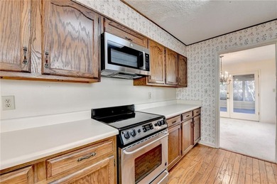 Nestled along the 5th fairway, this beautifully positioned home on Country Club of Roswell in Georgia - for sale on GolfHomes.com, golf home, golf lot