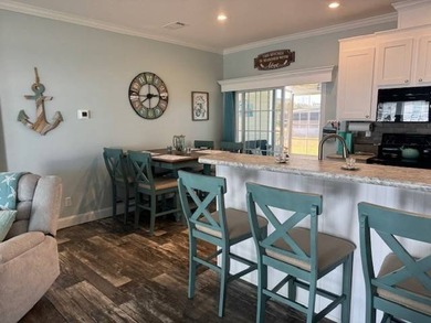 Welcome home to this impeccable 2-bedroom 2-bath sanctuary on Cypresswood Golf and Country Club in Florida - for sale on GolfHomes.com, golf home, golf lot