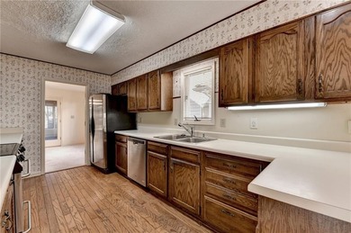 Nestled along the 5th fairway, this beautifully positioned home on Country Club of Roswell in Georgia - for sale on GolfHomes.com, golf home, golf lot