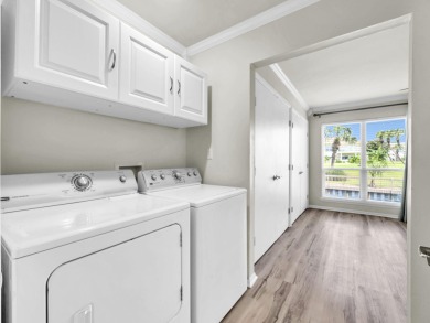 Welcome to your cozy coastal cottage on the canal at Sandpiper on Sandpiper Cove Golf Course in Florida - for sale on GolfHomes.com, golf home, golf lot