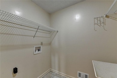 Nestled along the 5th fairway, this beautifully positioned home on Country Club of Roswell in Georgia - for sale on GolfHomes.com, golf home, golf lot