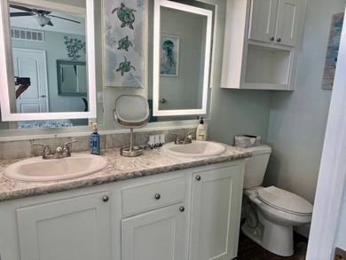 Welcome home to this impeccable 2-bedroom 2-bath sanctuary on Cypresswood Golf and Country Club in Florida - for sale on GolfHomes.com, golf home, golf lot