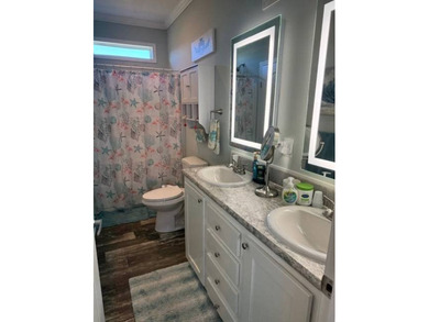 Welcome home to this impeccable 2-bedroom 2-bath sanctuary on Cypresswood Golf and Country Club in Florida - for sale on GolfHomes.com, golf home, golf lot