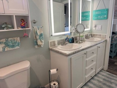 Welcome home to this impeccable 2-bedroom 2-bath sanctuary on Cypresswood Golf and Country Club in Florida - for sale on GolfHomes.com, golf home, golf lot