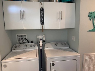 Welcome home to this impeccable 2-bedroom 2-bath sanctuary on Cypresswood Golf and Country Club in Florida - for sale on GolfHomes.com, golf home, golf lot