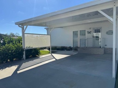Welcome home to this impeccable 2-bedroom 2-bath sanctuary on Cypresswood Golf and Country Club in Florida - for sale on GolfHomes.com, golf home, golf lot